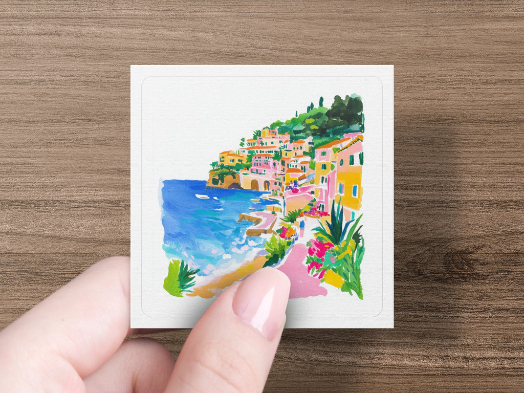 Watercolor painting of colorful coastal village with blue sea and green hills.