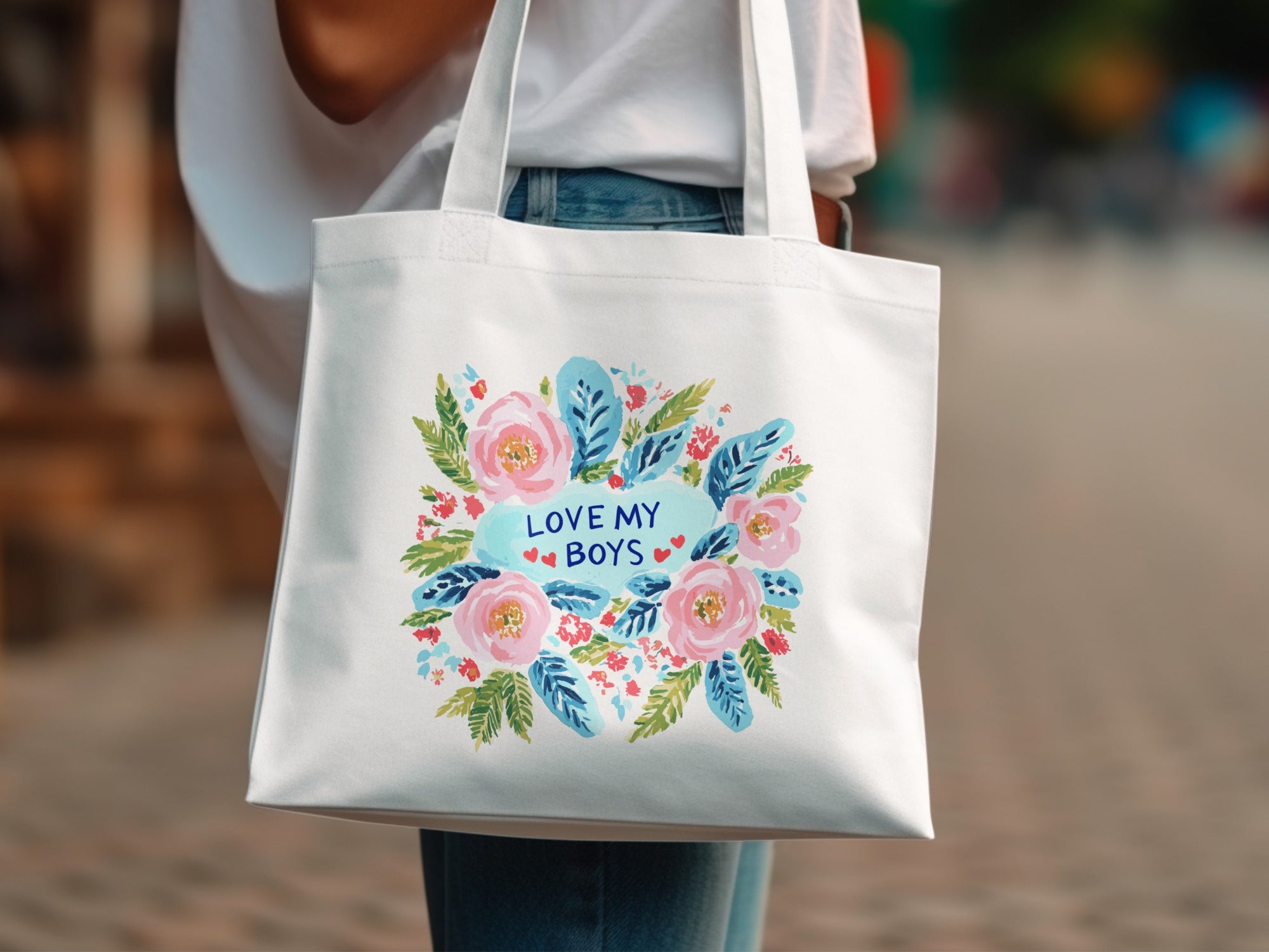 White canvas tote bag with floral design and text "LOVE MY BOYS".