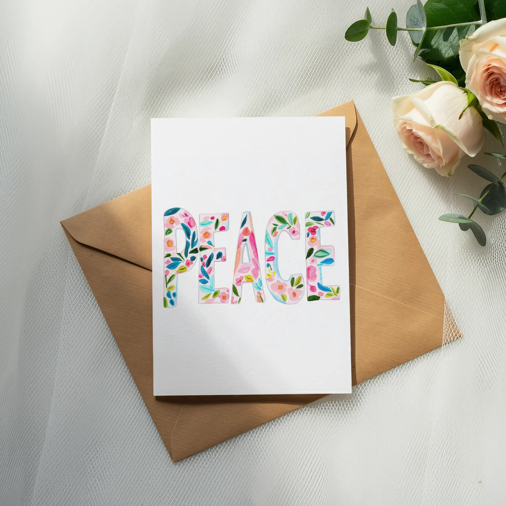Card with "Peace" in floral letters on kraft envelope, with roses.
