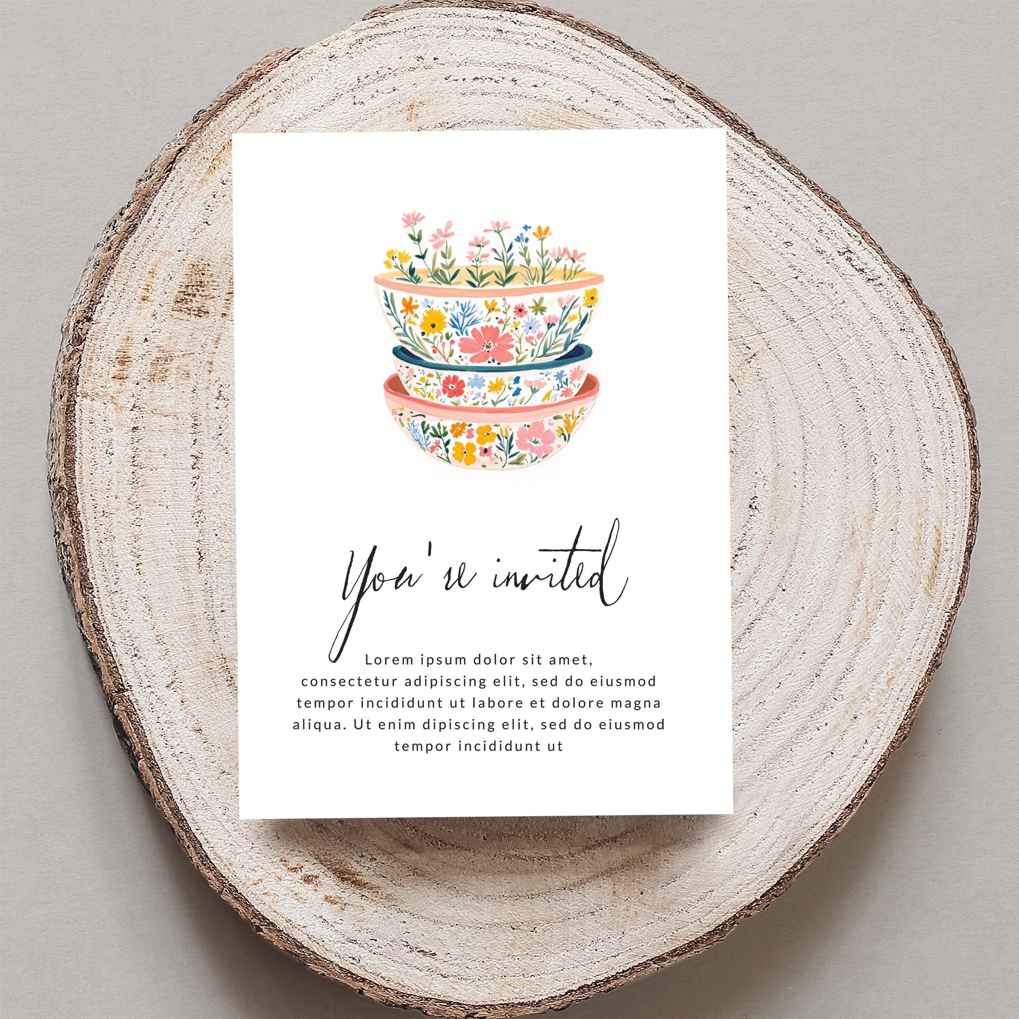 Invitation card with floral bowls, "You're invited" text, and placeholder copy.