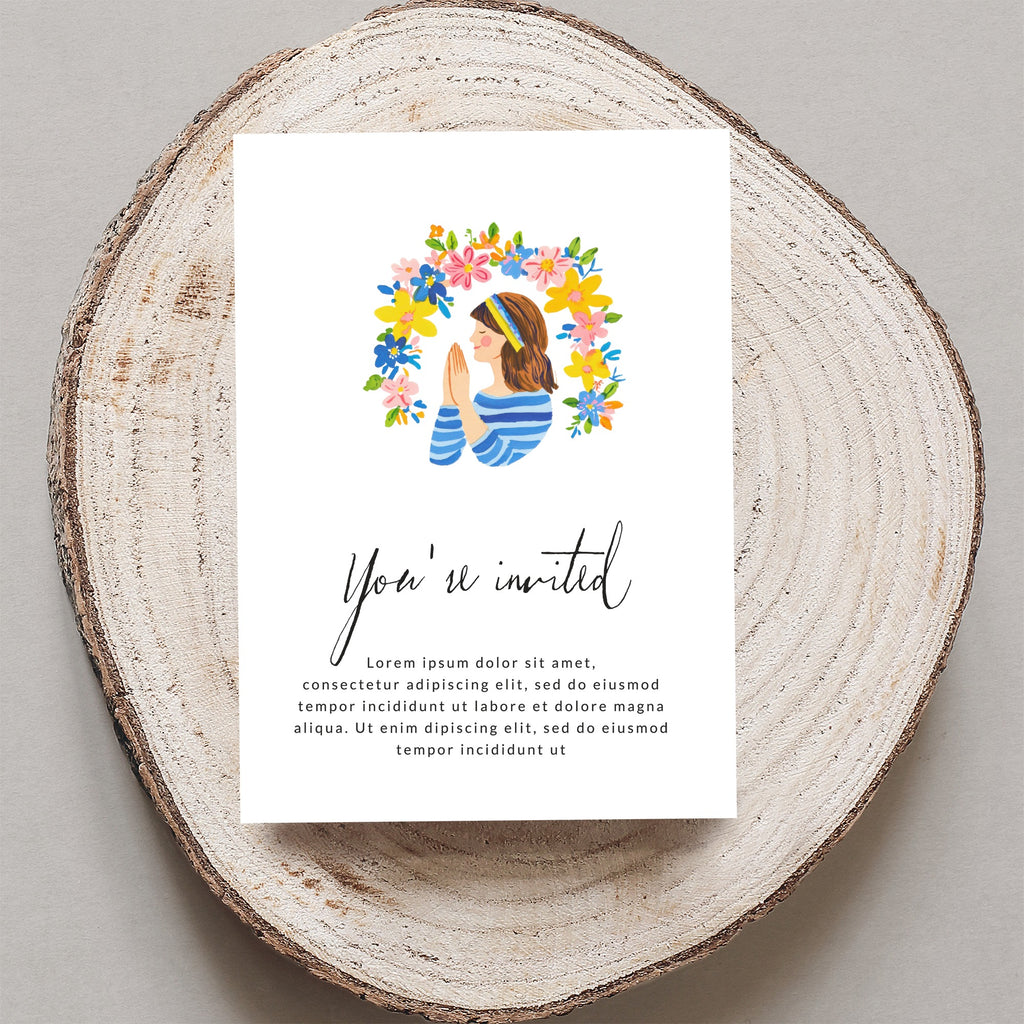 Invitation with "You're invited" and placeholder text on wood slice.