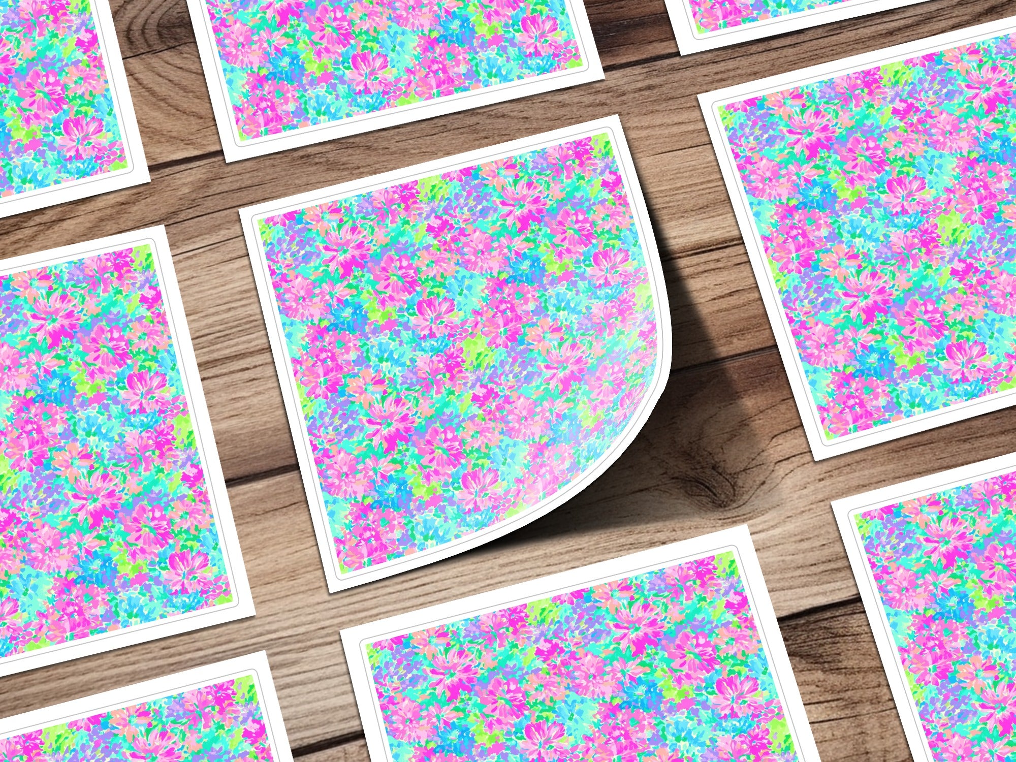 Floral pattern stationery cards on a wooden background.