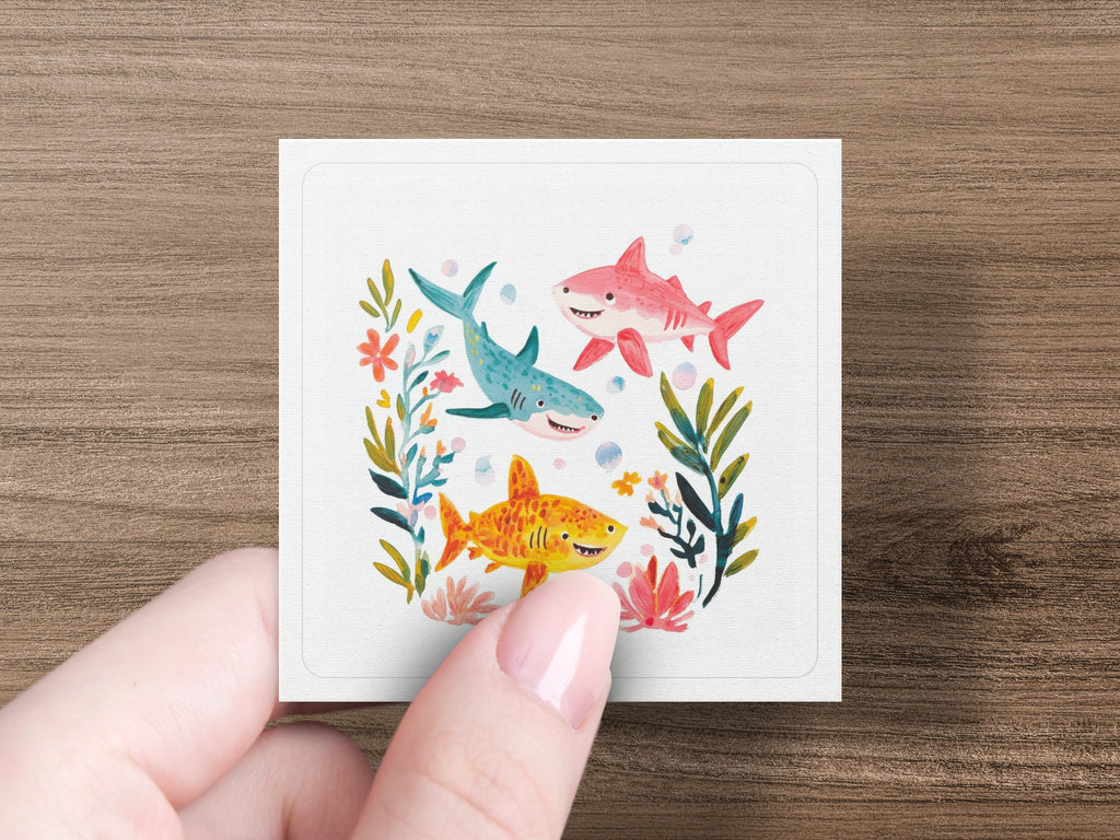 Three cartoon sharks swimming with colorful flowers.