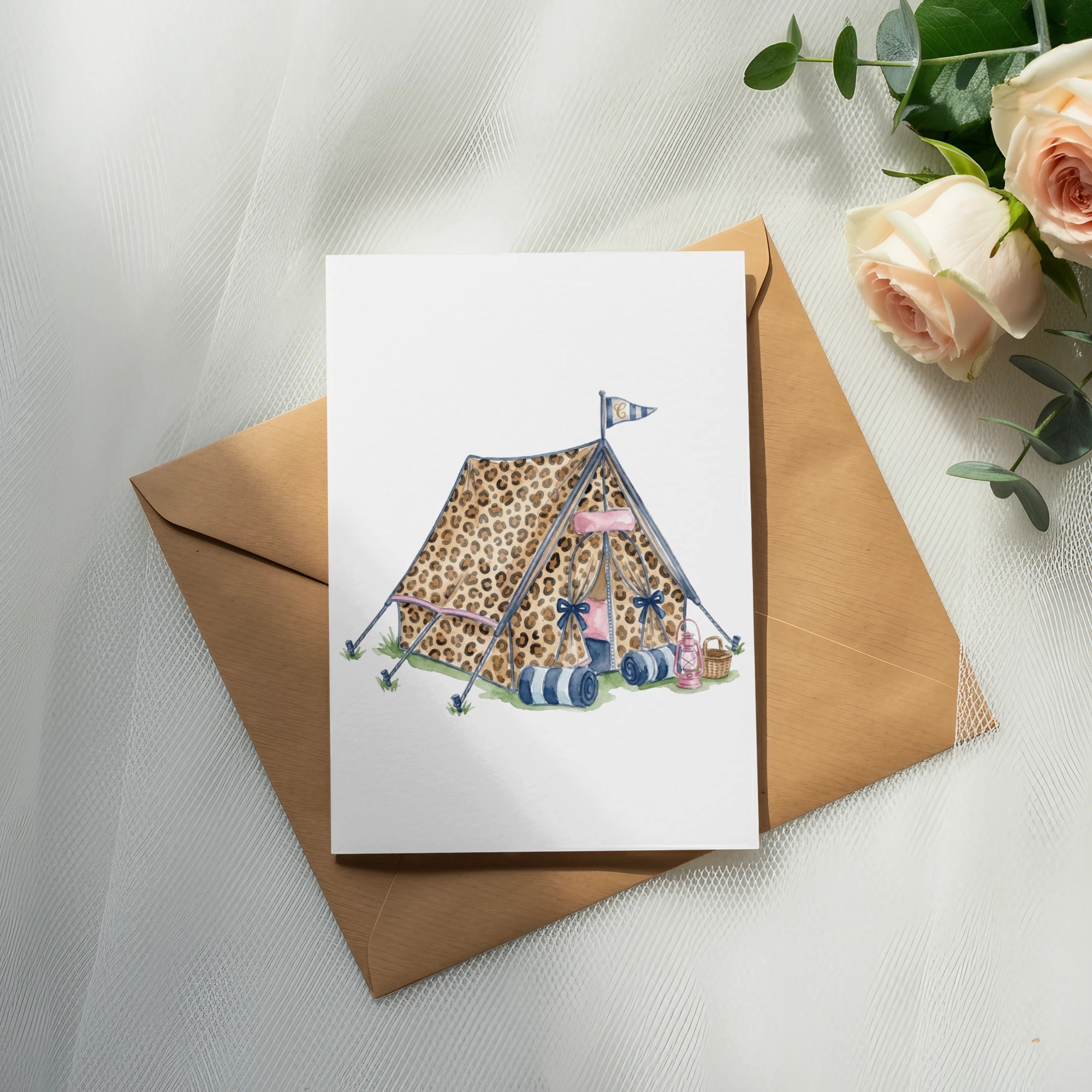 Leopard print tent with sleeping bags, lantern, and flag on card.