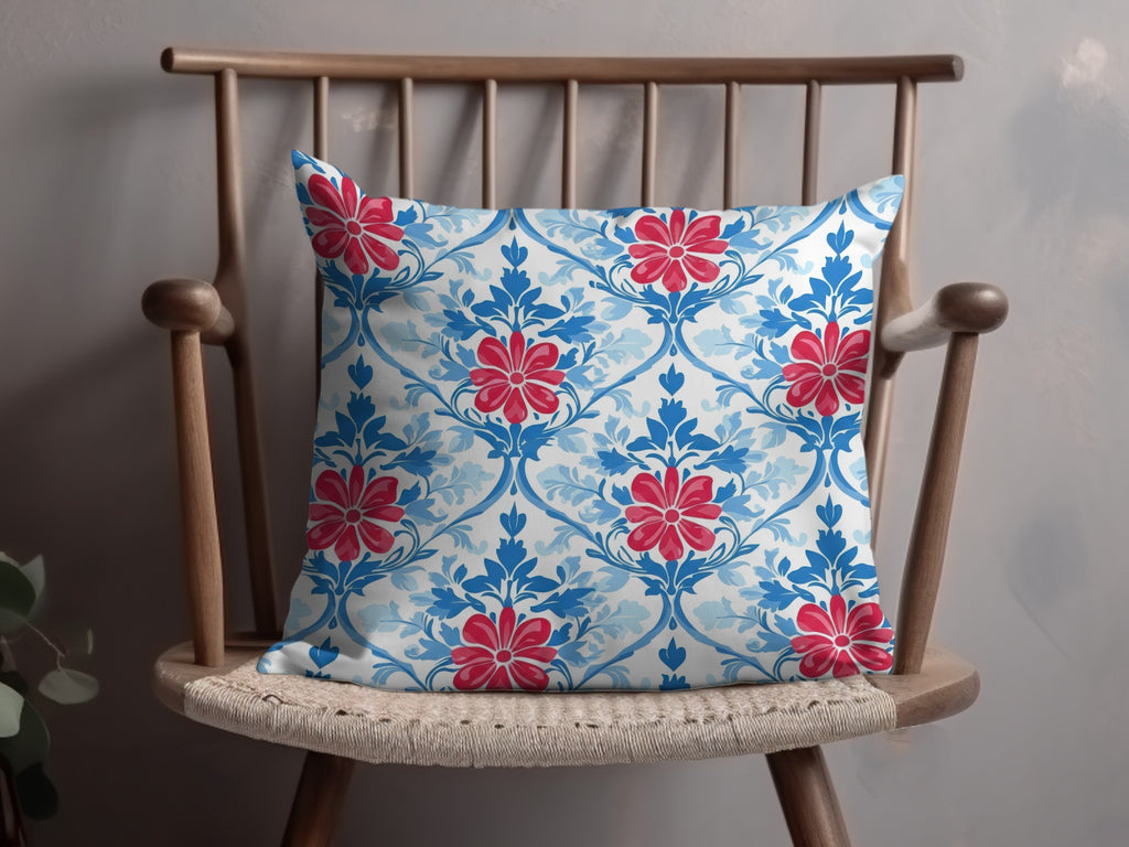 Decorative throw pillow with a blue and red floral damask pattern.