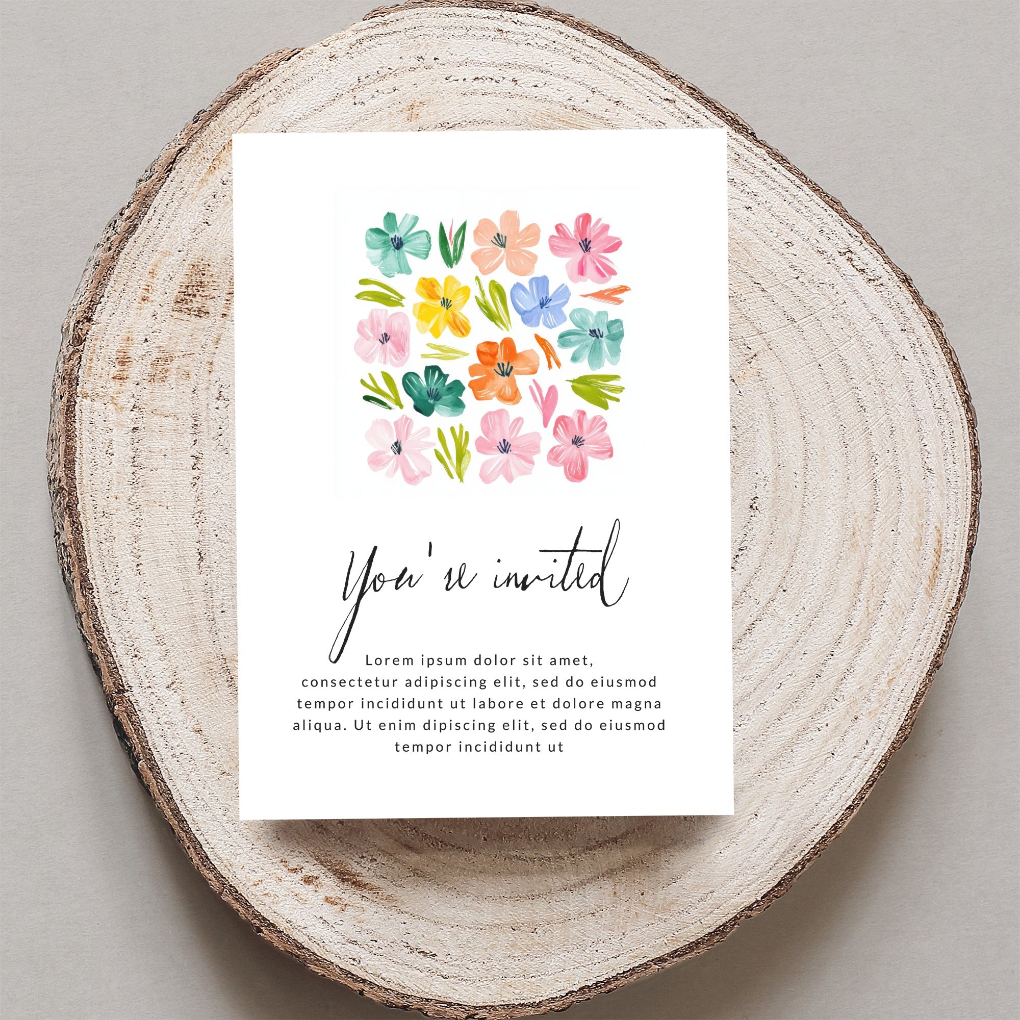 Invitation card with floral design and "You're invited" text.