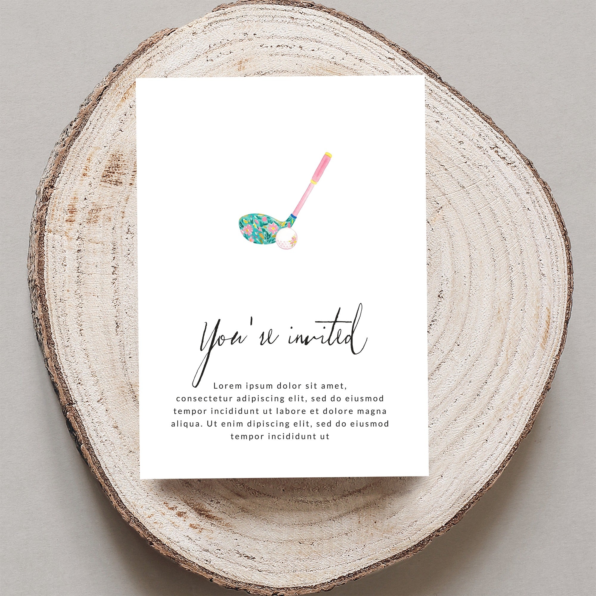 Golf club and floral pattern on a wedding invitation.
