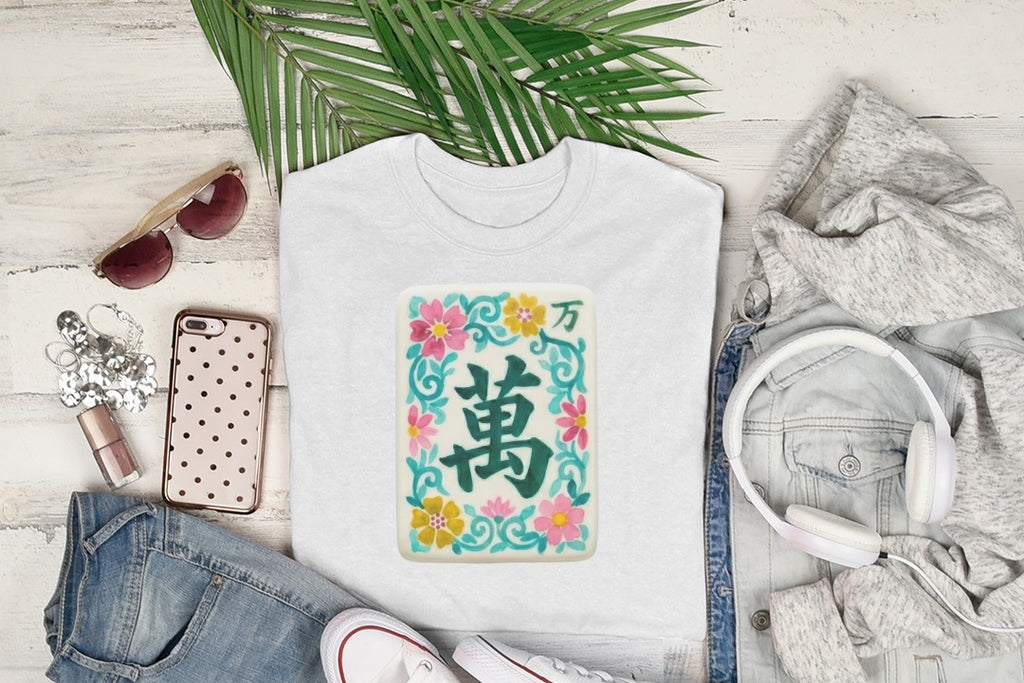 White t-shirt with a floral Mahjong tile design.
