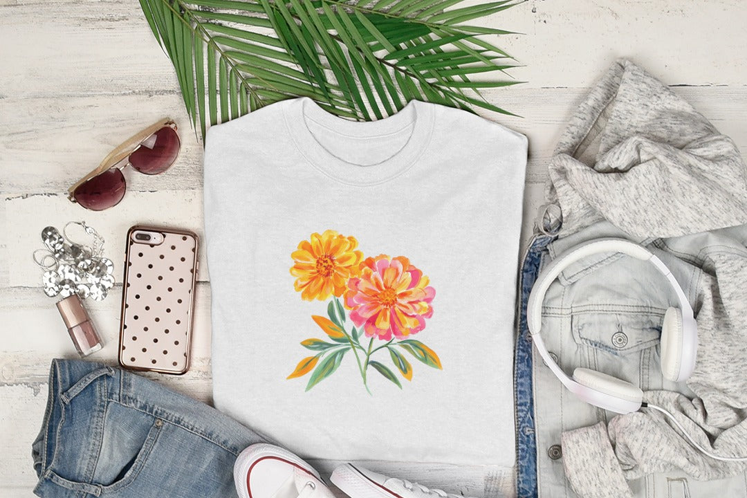 White t-shirt with orange and pink floral watercolor design.