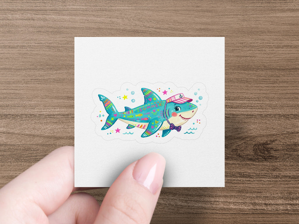 Cute cartoon shark wearing a sailor hat, bow tie, and tiny bow.