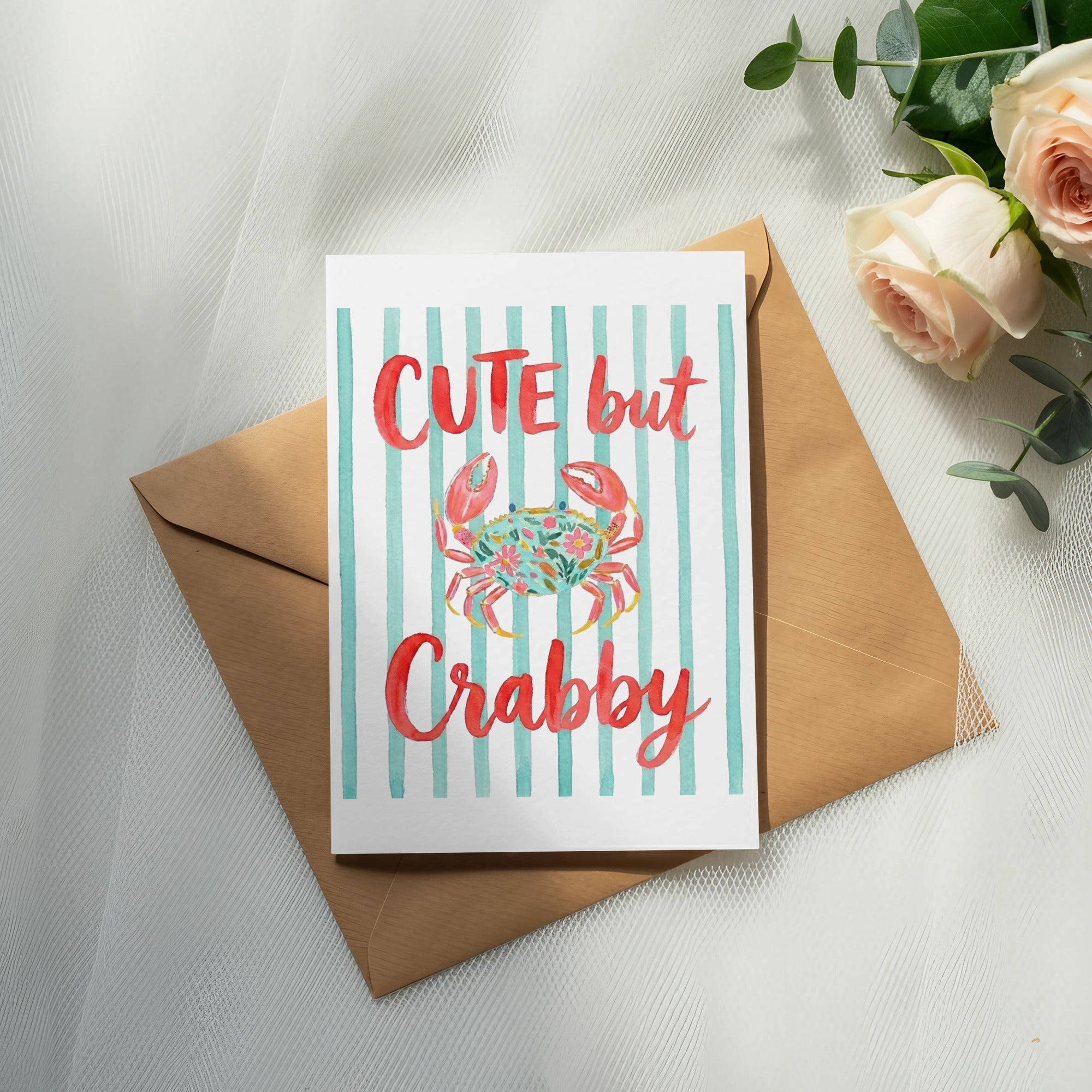 Card with "CUTE but Crabby" text and watercolor crab and flowers.