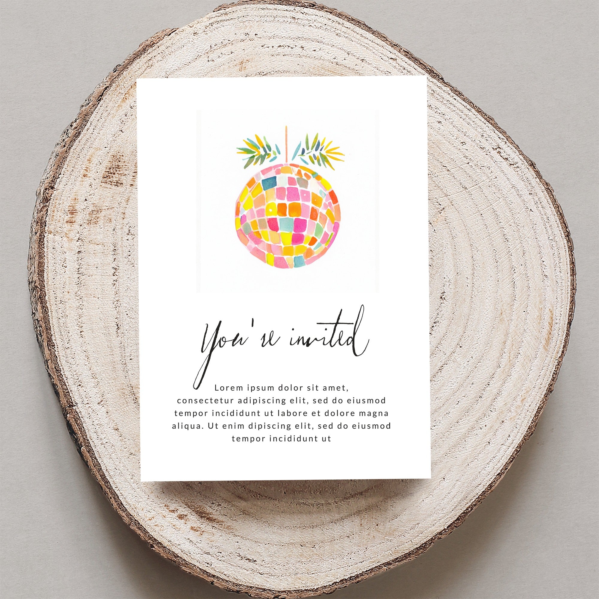 Invitation with "You're invited" text and a colorful disco ball.