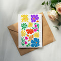 Card with colorful floral illustrations on a brown envelope.