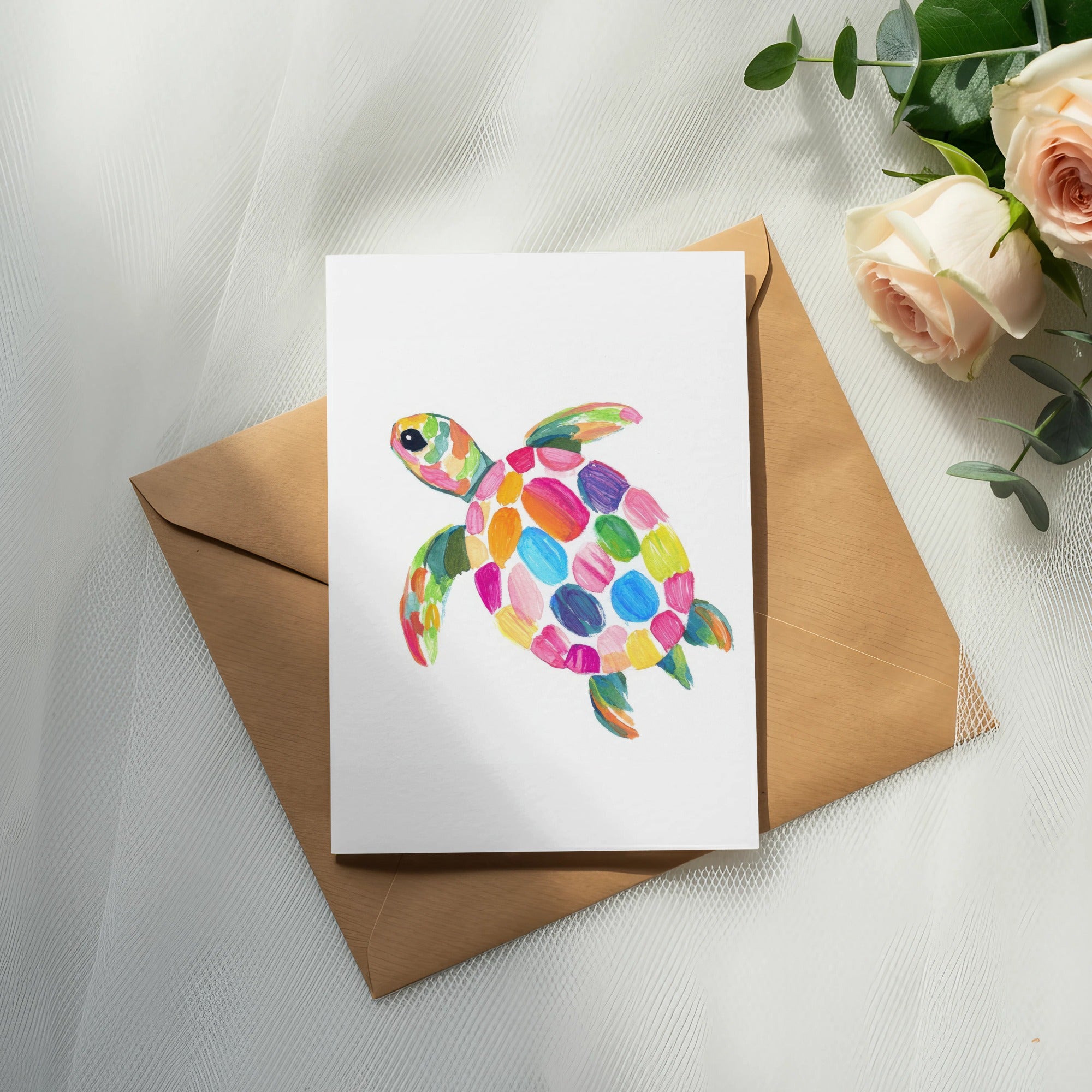 Colorful painted sea turtle illustration on a white card with an envelope.