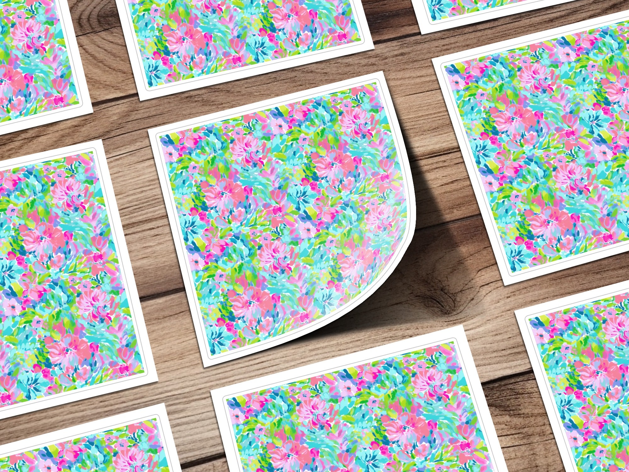 Floral pattern cards on a wooden surface.