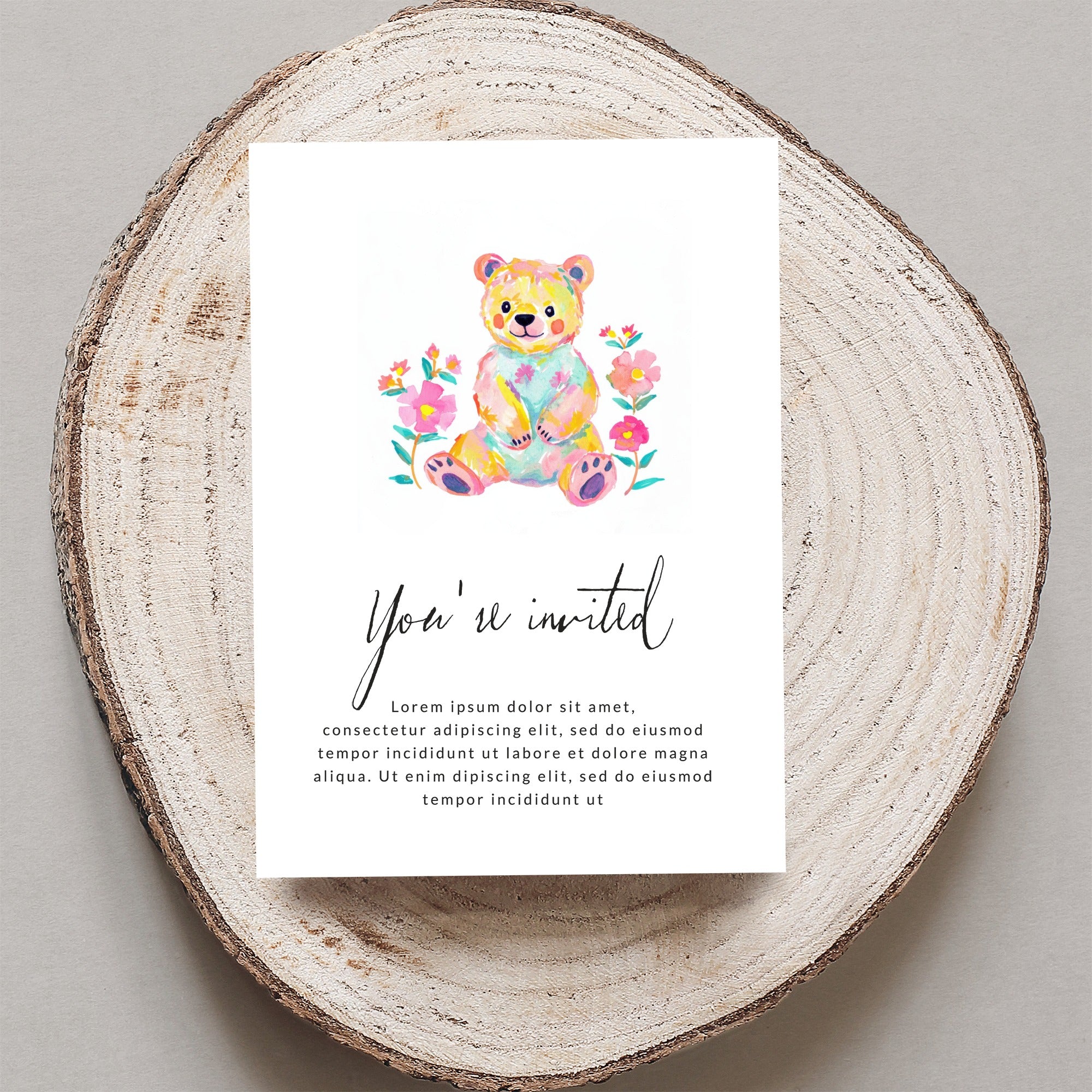 Watercolor teddy bear on invitation with "You're invited" text.