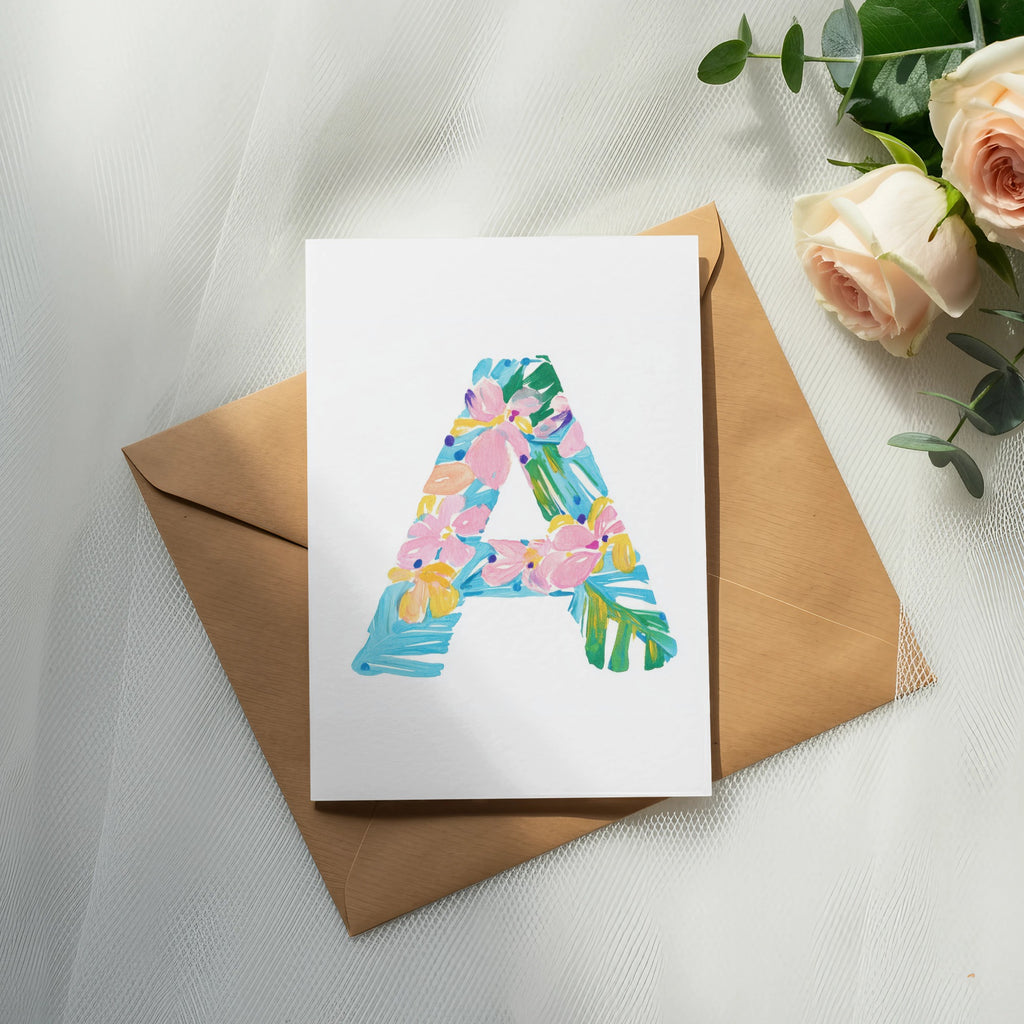 Card with a colorful letter "A" design on a brown envelope.