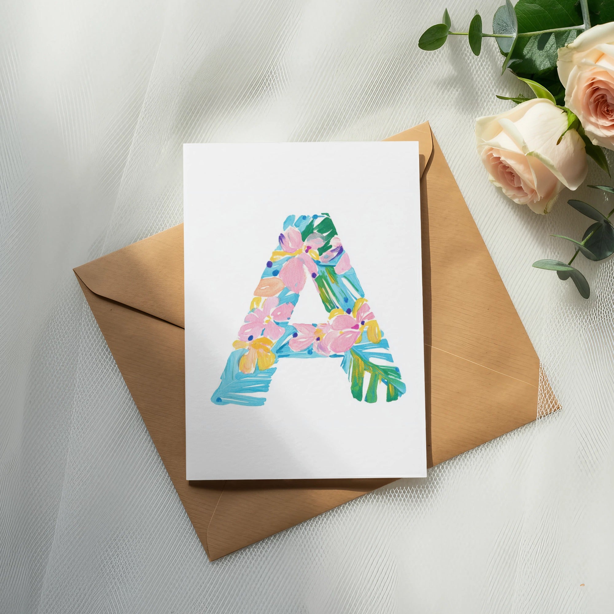 Card with a colorful letter "A" design on a brown envelope.