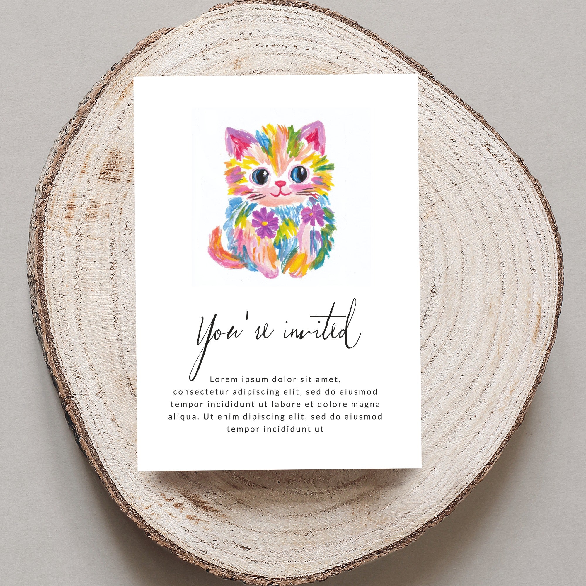 Colorful watercolor kitten on an invitation that reads "You're invited" and placeholder text.