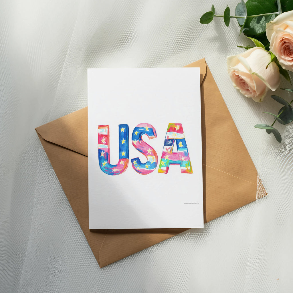 Watercolor USA text on card, placed on envelope with roses.