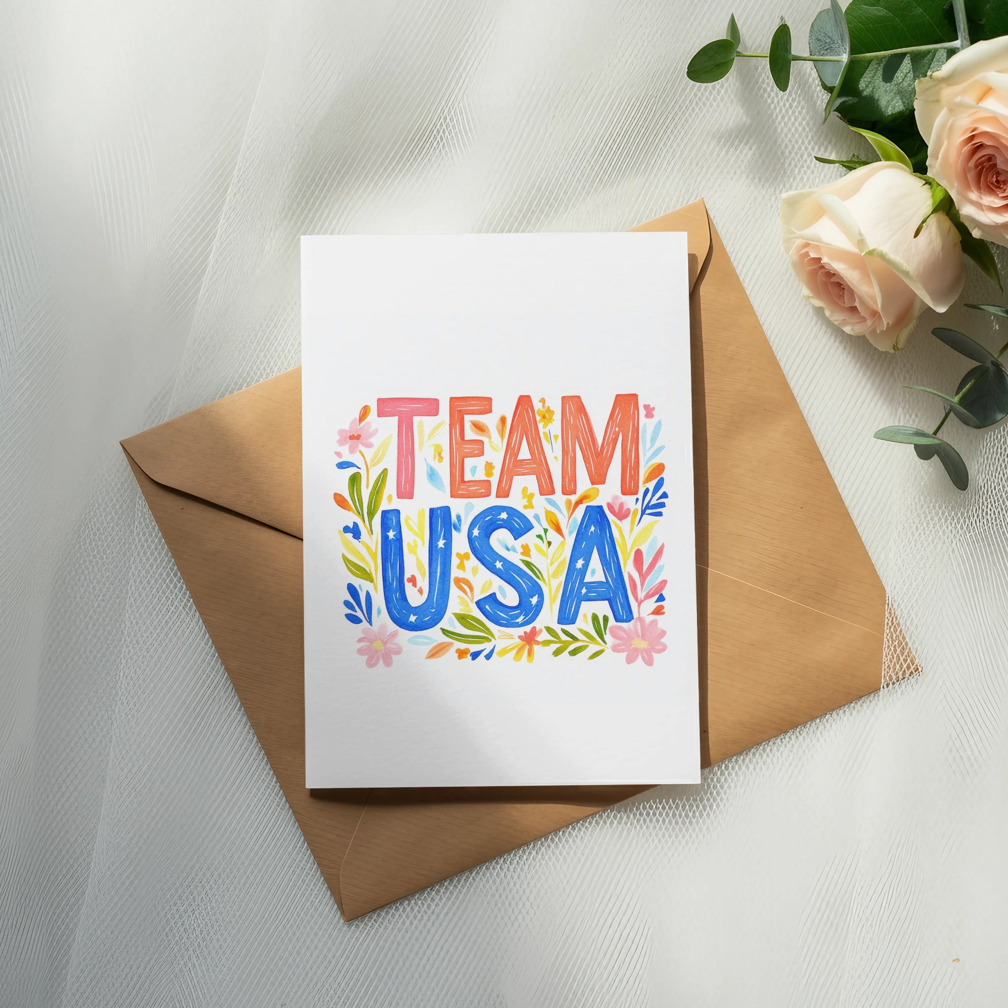 Card with "TEAM USA" in colorful, floral lettering on an envelope.