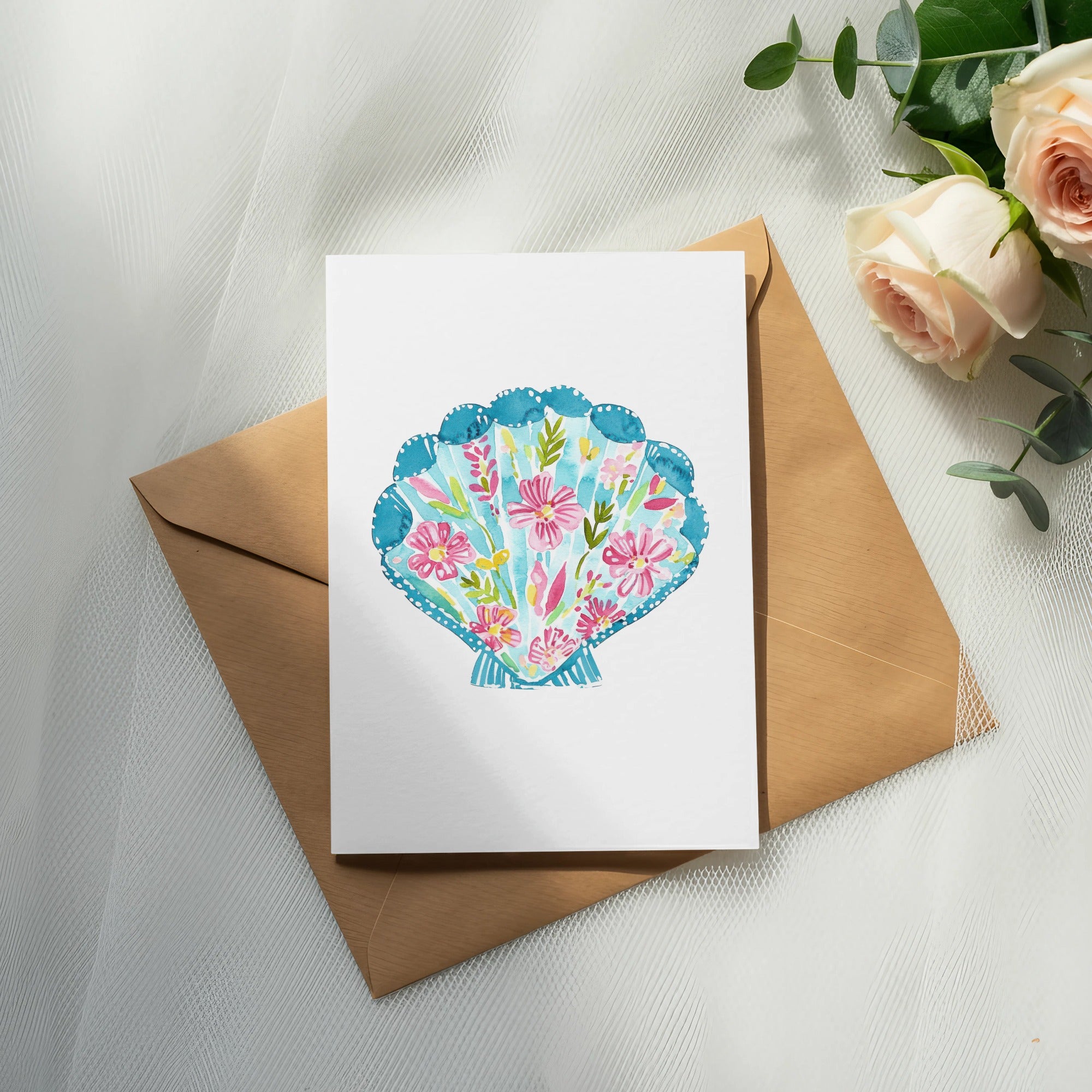 White card with seashell floral illustration on brown envelope.
