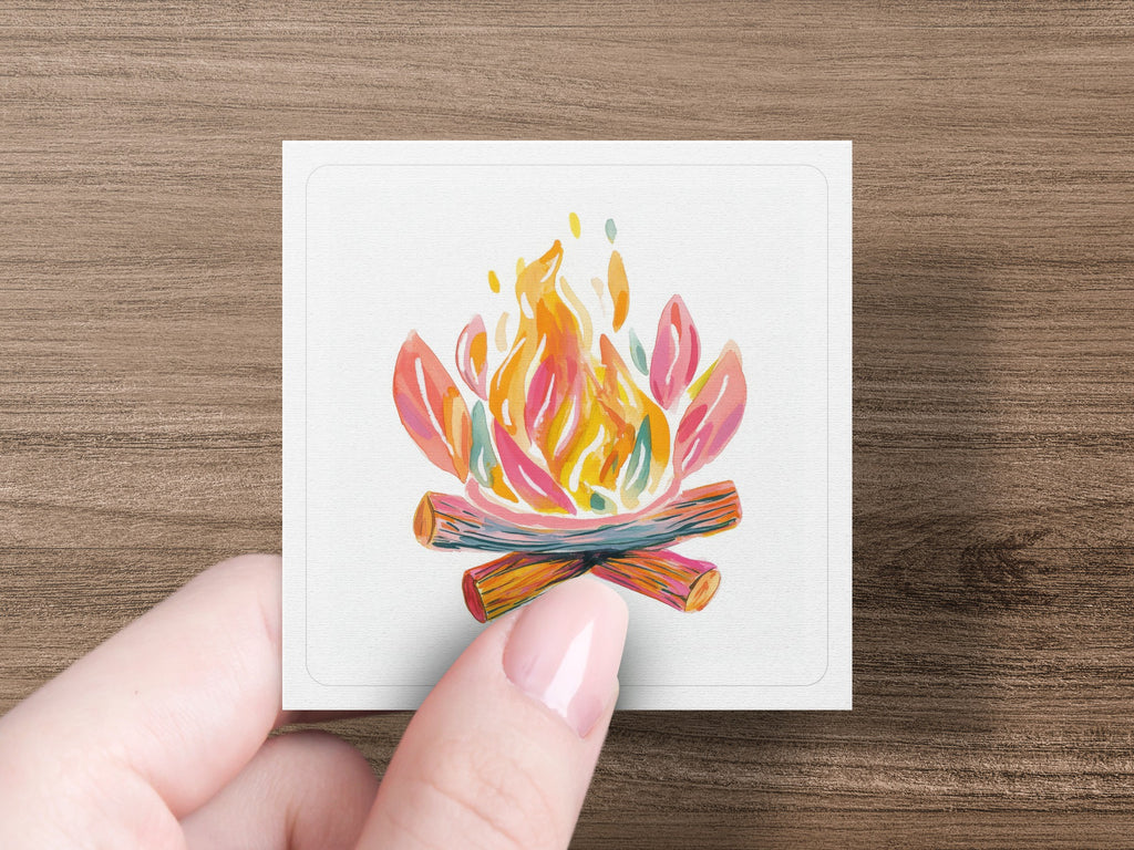 Watercolor illustration of a campfire with colorful flames and logs on a white card.