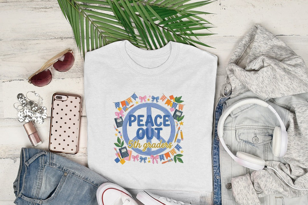 White t-shirt with "Peace Out 5th Graders" text and colorful graphic elements.