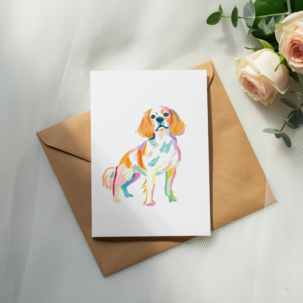 Watercolor painting of a Cavalier King Charles Spaniel on a card.