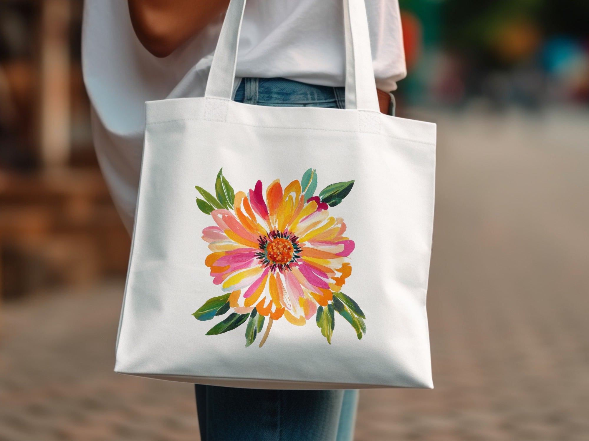 White tote bag with a vibrant, colorful watercolor floral design.