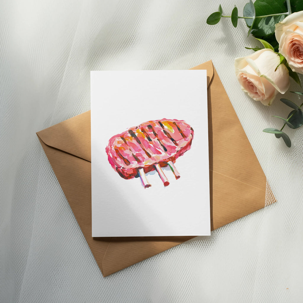 Watercolor illustration of grilled lamb chops on a card, with roses and eucalyptus.