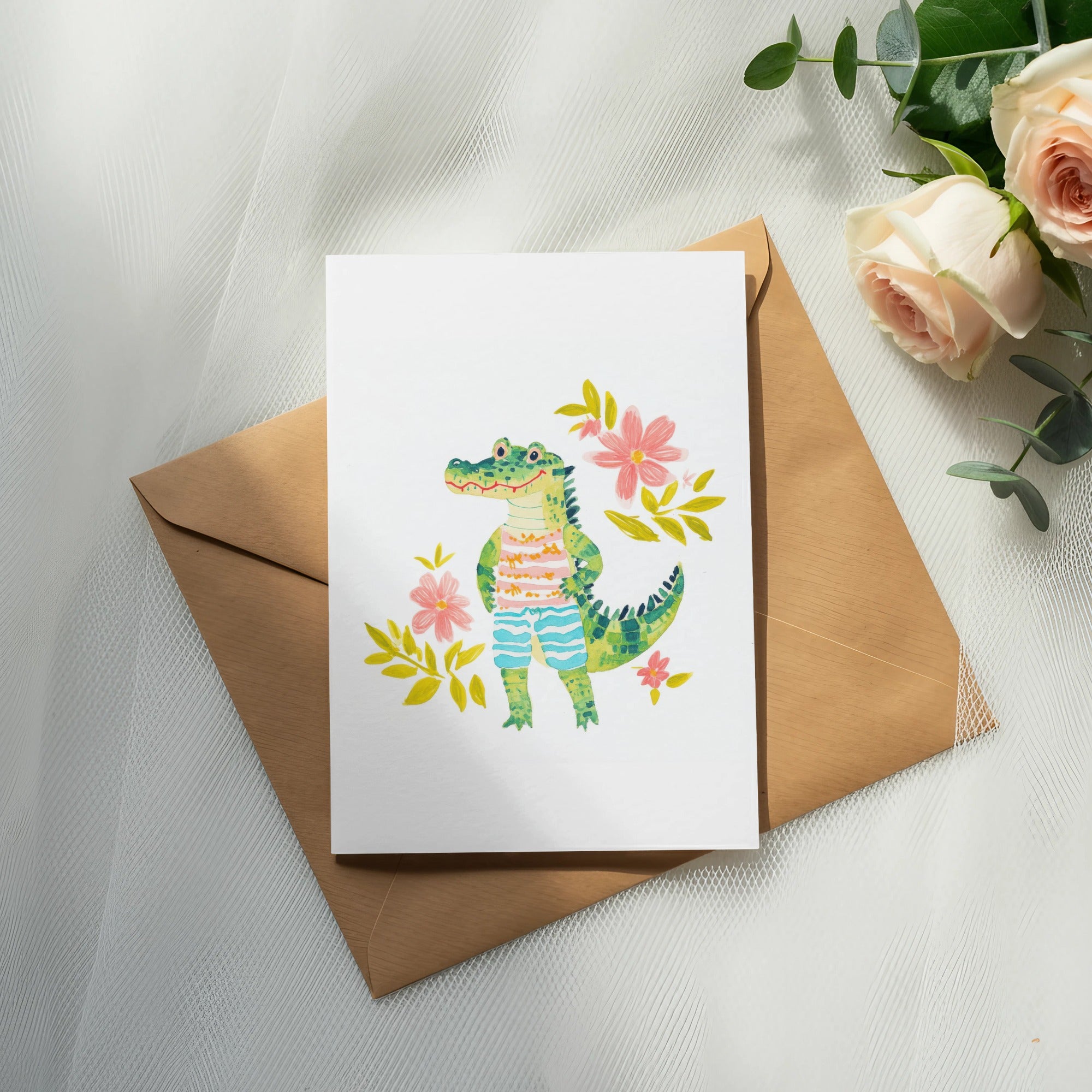 Card with cartoon alligator wearing striped shorts, surrounded by flowers.