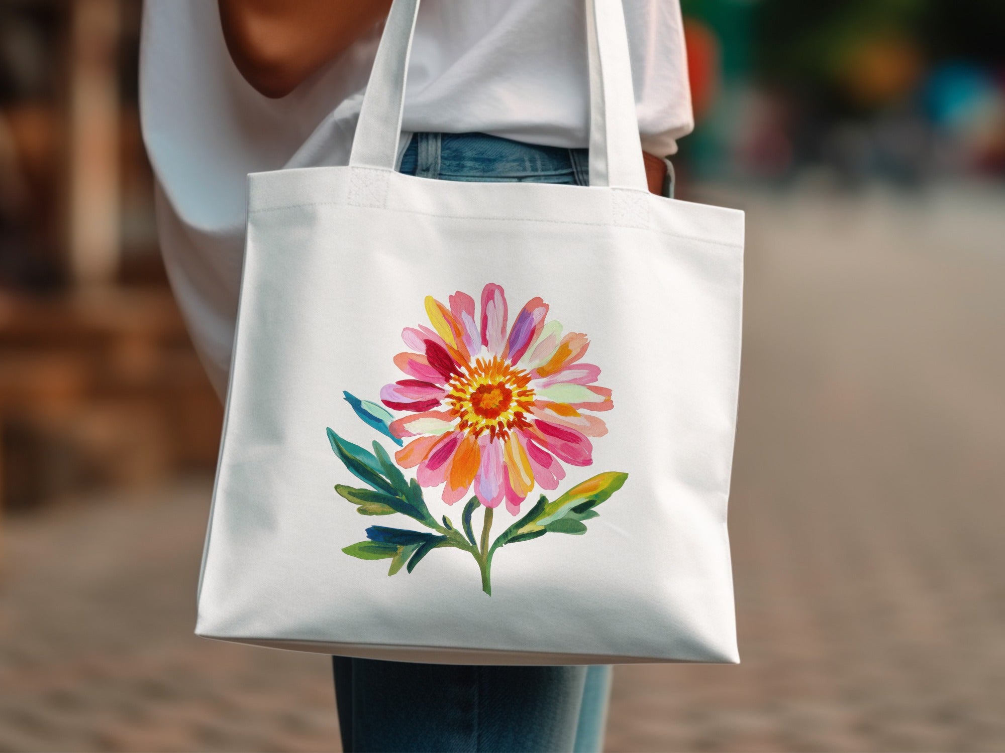 White tote bag with colorful floral illustration.