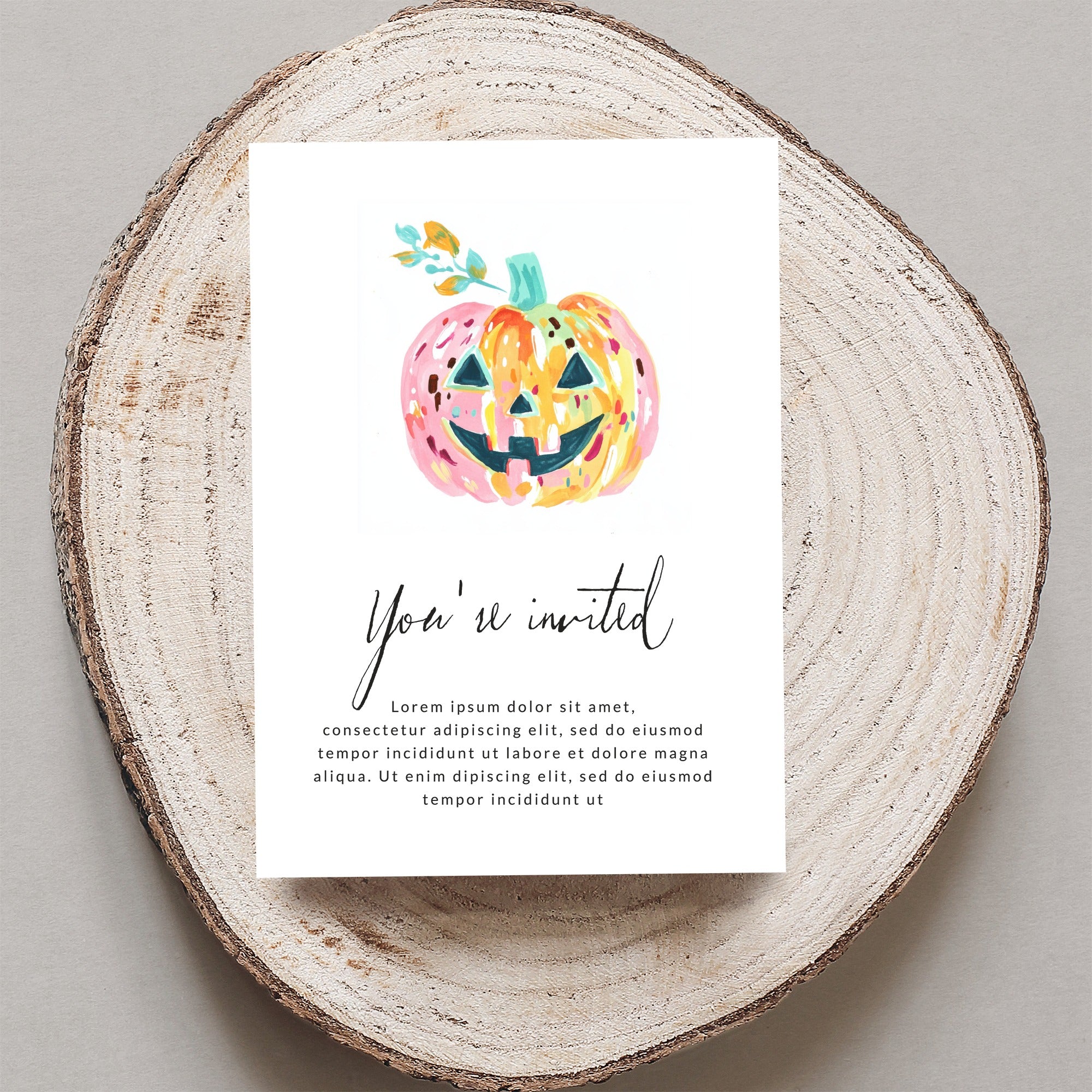 Halloween invitation with watercolor pumpkin and "You're invited" text.