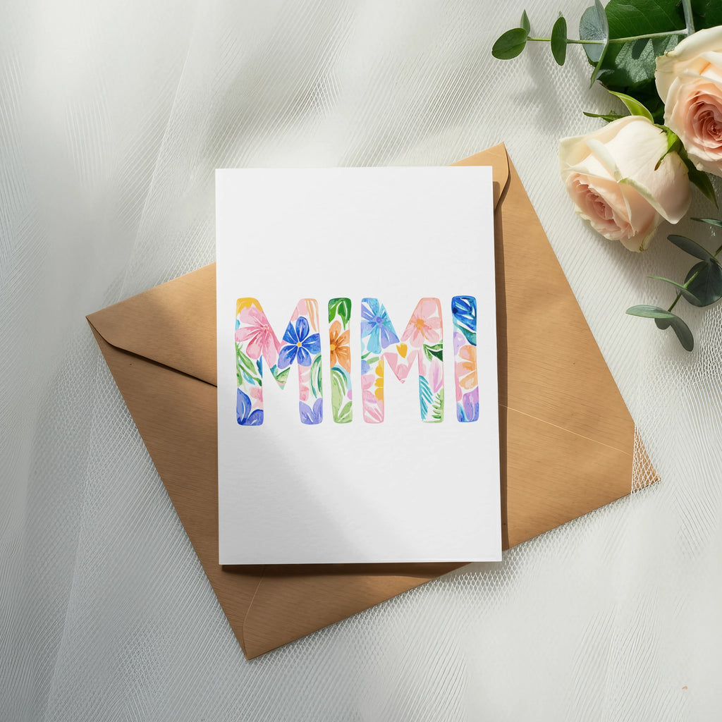 Card with "MIMI" written in floral watercolor letters, on an envelope.