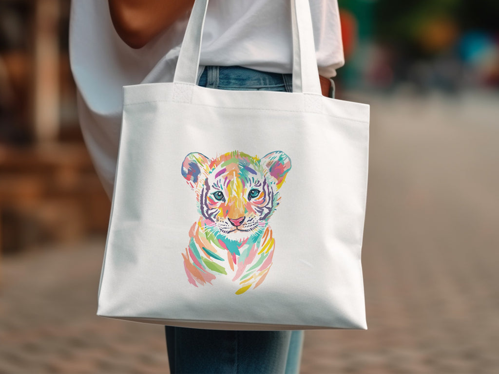 White tote bag with a colorful watercolor tiger cub illustration.