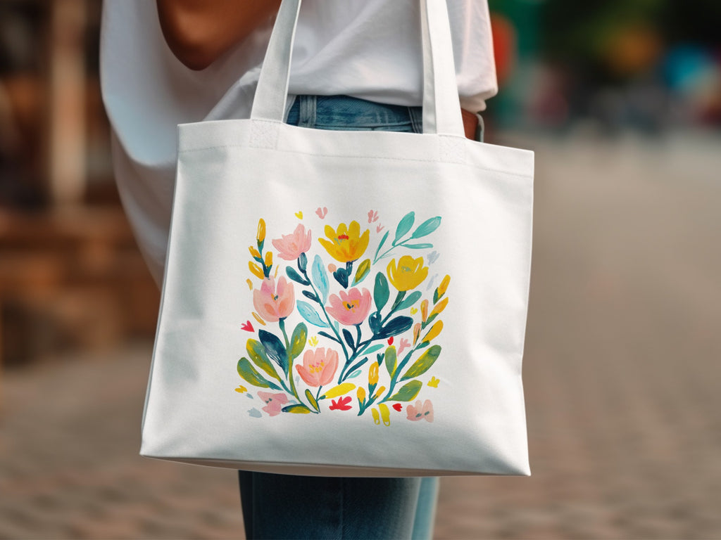 White tote bag with colorful floral illustration.