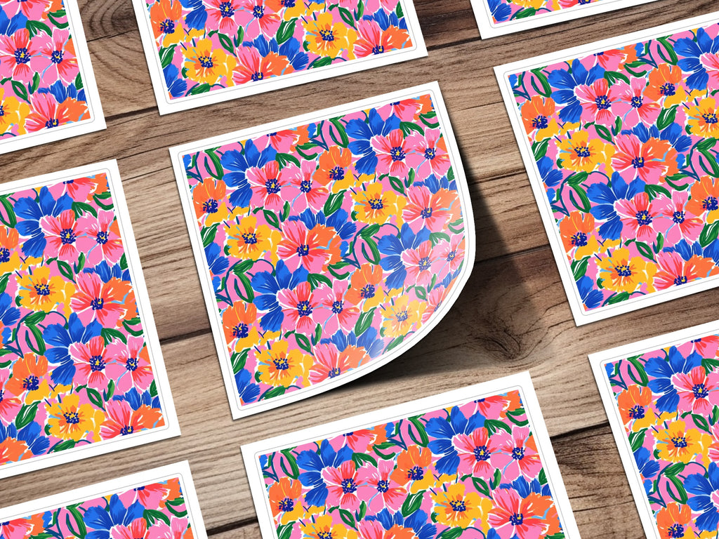 Floral pattern stickers with pink, blue, and yellow flowers on wood background.