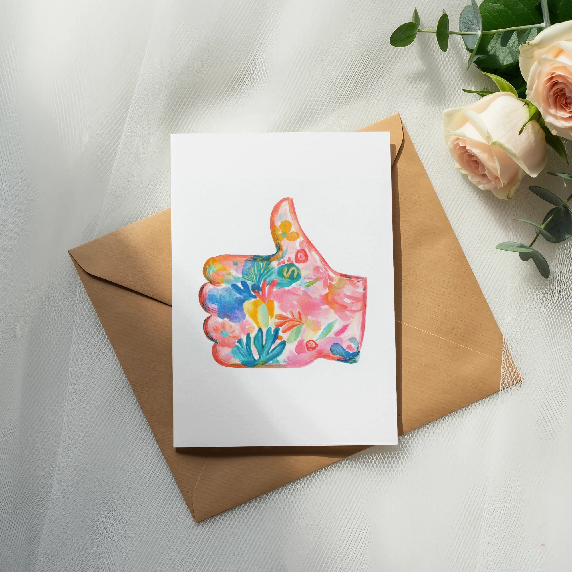 Card with floral thumb up design on brown envelope with roses.