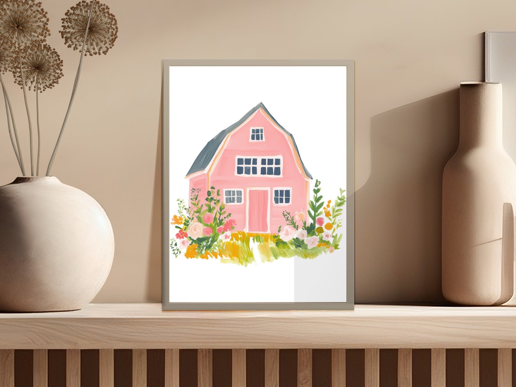 Pink barn surrounded by colorful flowers on a shelf.