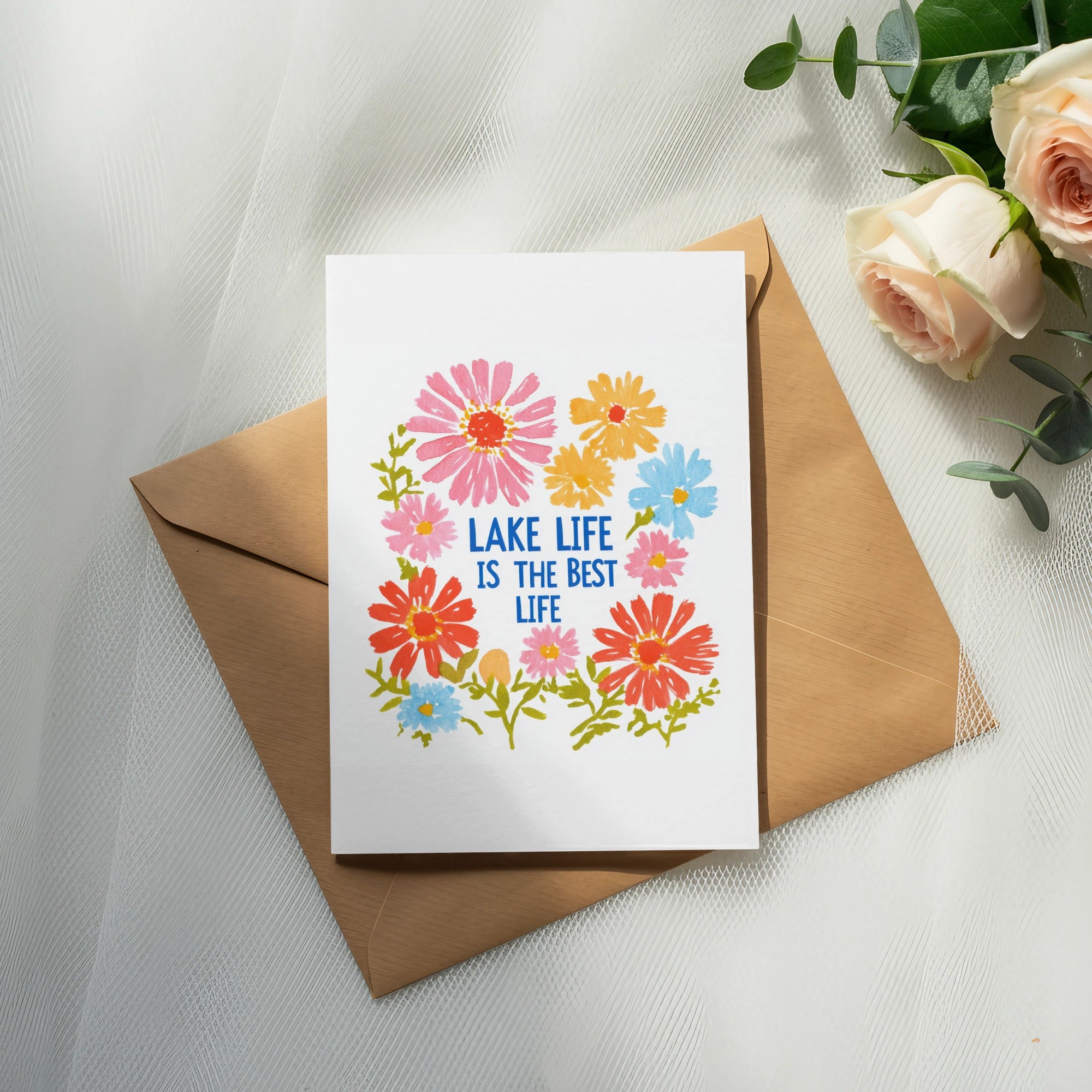 Card with colorful flowers and text "Lake life is the best life".