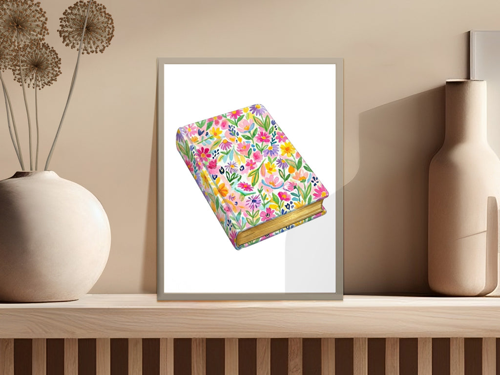 Watercolor illustration of a floral patterned book with gold-edged pages on a shelf.