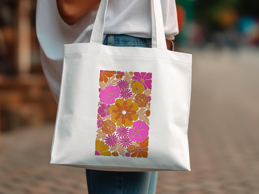 White tote bag with colorful retro floral pattern.
