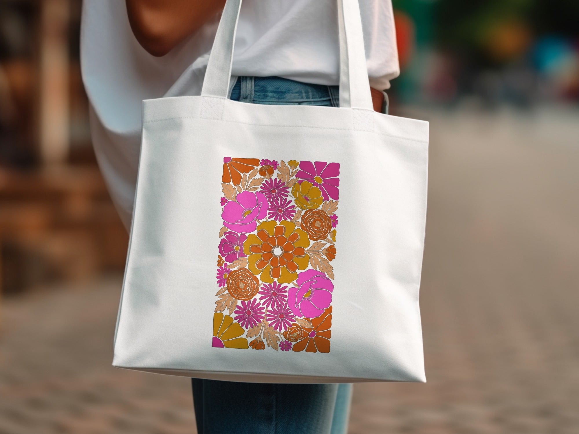 White tote bag with colorful retro floral pattern.