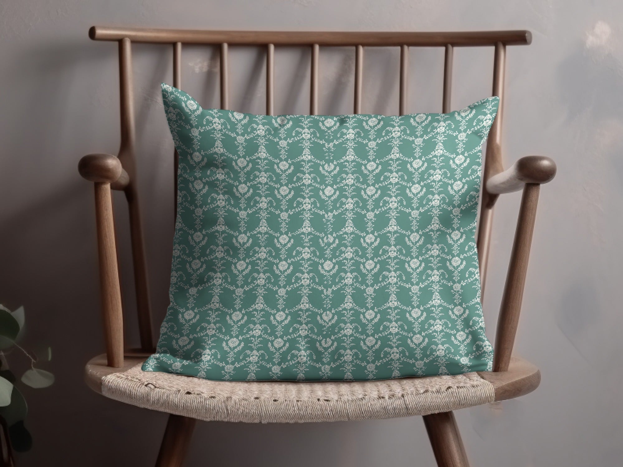 Elegant Teal Cushion with Intricate White Floral Pattern