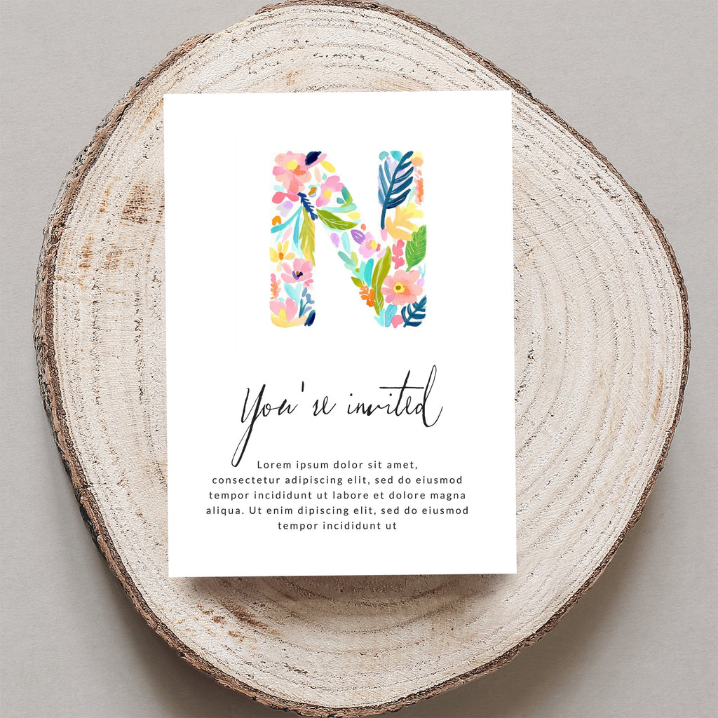 Floral letter "N" on invitation with "You're invited" and placeholder text.
