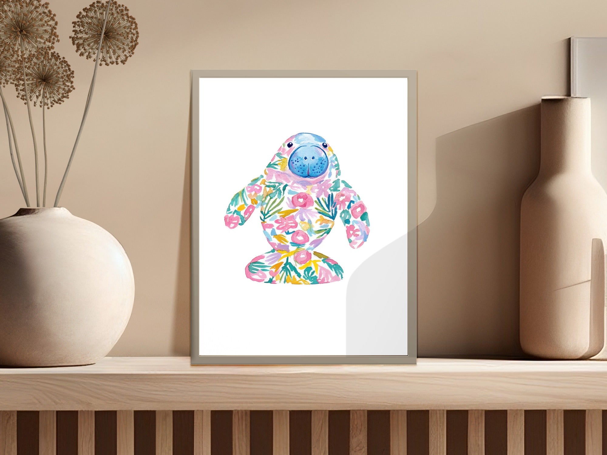 Watercolor manatee illustration with floral pattern on white background.