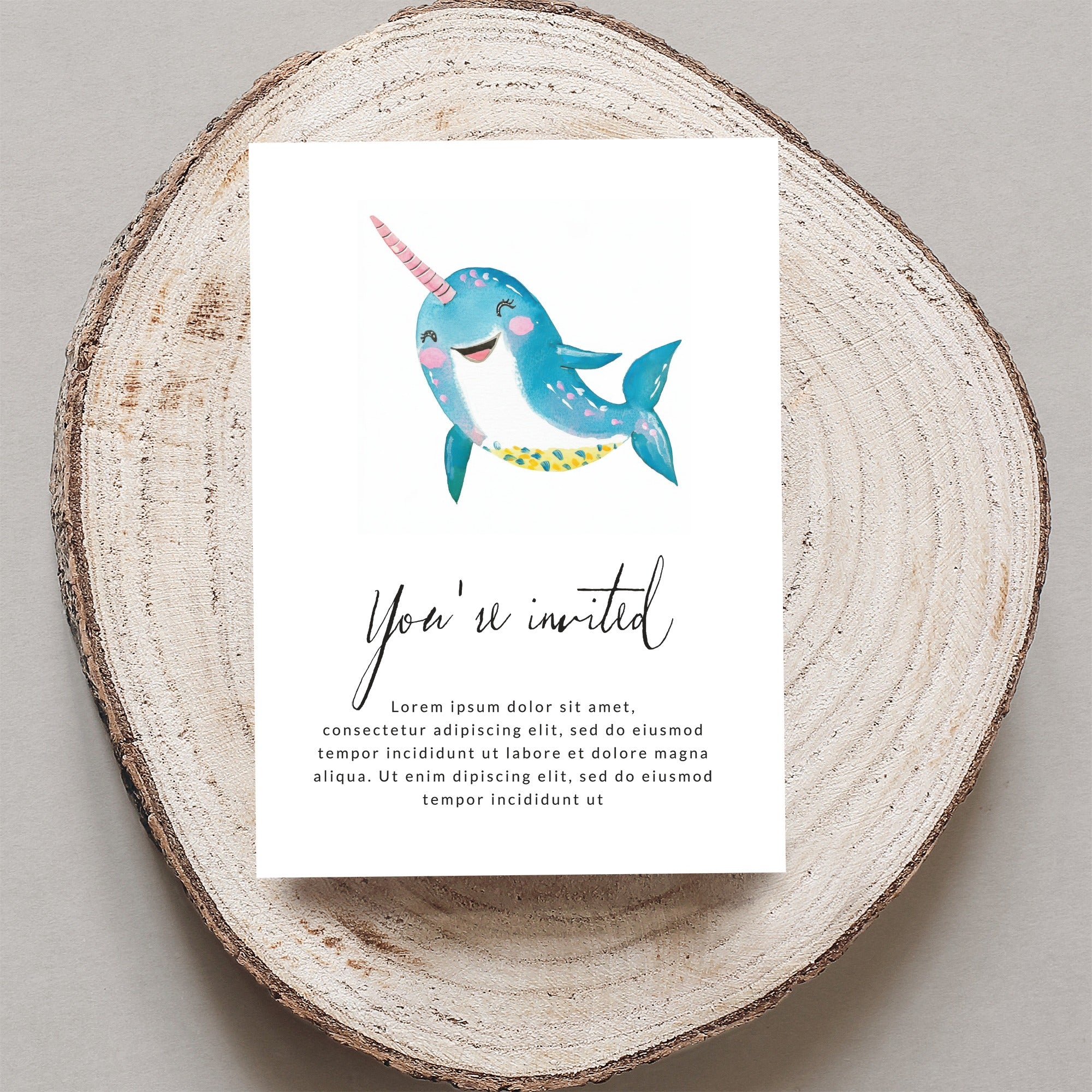 Invitation card with cartoon narwhal and "You're invited" text.