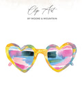 Heart-shaped sunglasses with colorful lenses and "Clip Art by Moore & Mountain" text.
