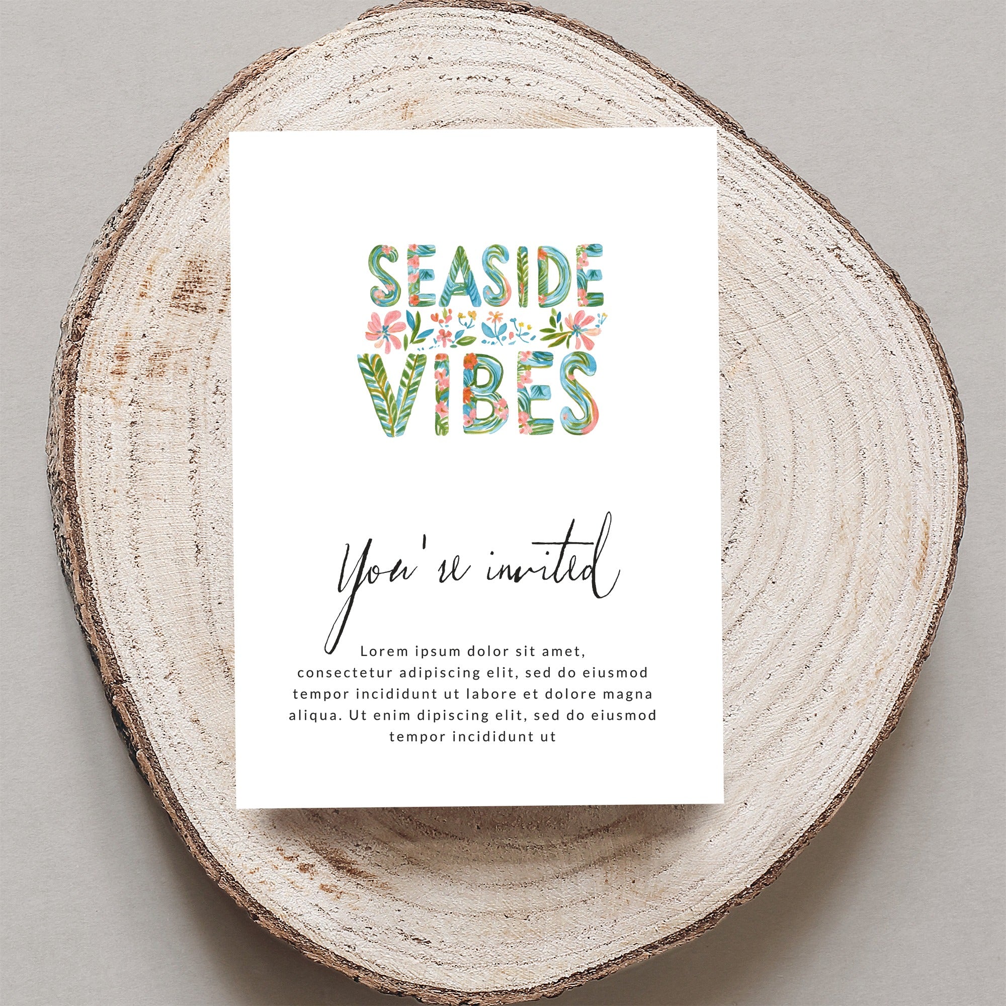 "Seaside Vibes" invitation card with floral letters and placeholder text.